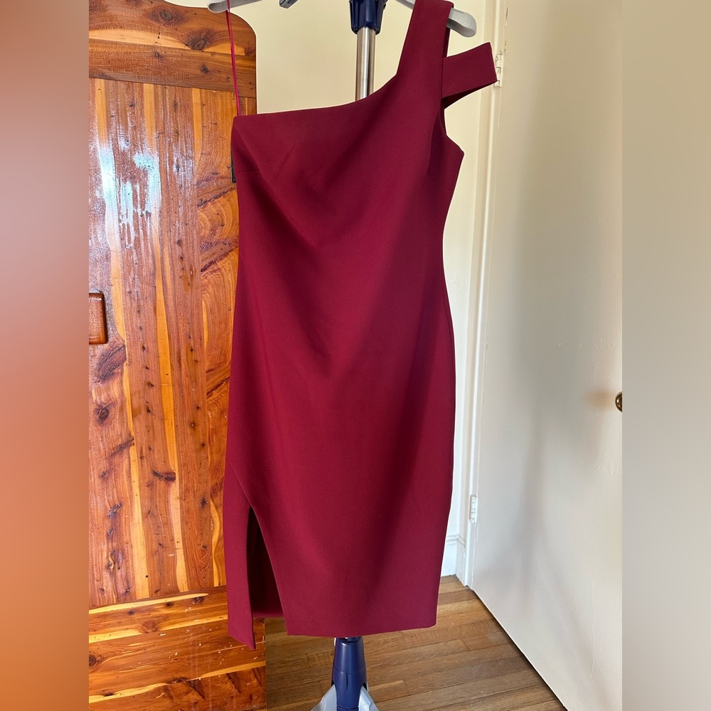 Likely burgundy dress